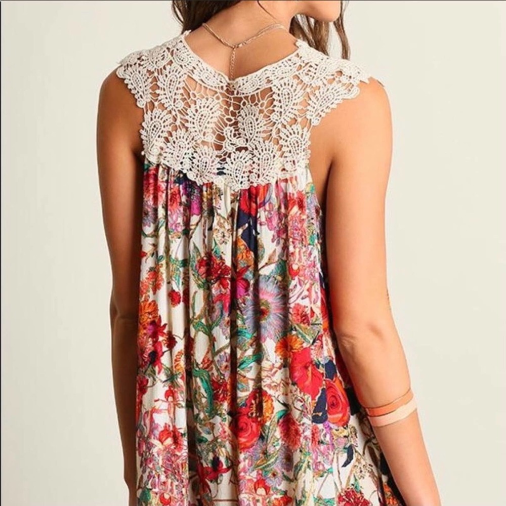 Umgee floral crochet tunic dress in a medium. It flows and swings so nicely. Fun